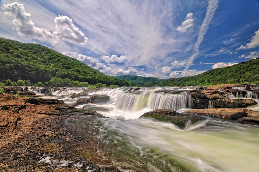 Sandstone Falls in The New River Gorge National Park and Preserve. From the photographer: “The falls’ 1,500-foot width is accessible by a boardwalk and bridges that span the two islands below the falls. If you like adventure, you can scramble off-trail to a point face-to-face with the falls.”