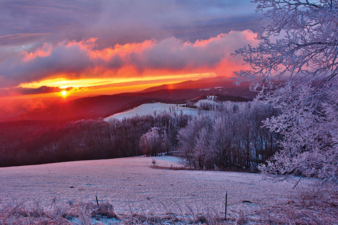 This image is on Shawnee Mountain in Watauga County, North Carolina, just outside of Banner Elk. From the photographer: “This is titled Fire & Ice. I love this spot because the views are just incredible as it looks down on the little community of Cool Springs. The sunrises and sunsets are indescribable.”
