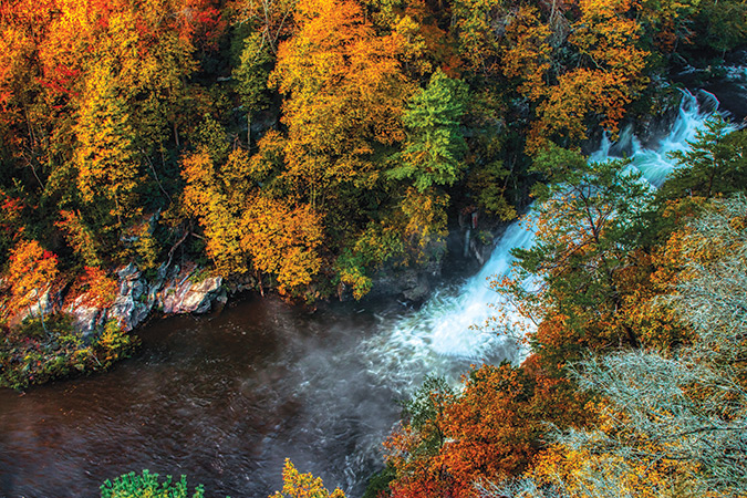 Within Tallulah State Park in Northern Georgia, a 1,000-foot Gorge is carved out by the Tallulah River, with Tallulah Falls visible from several overlooks along the hiking trail.