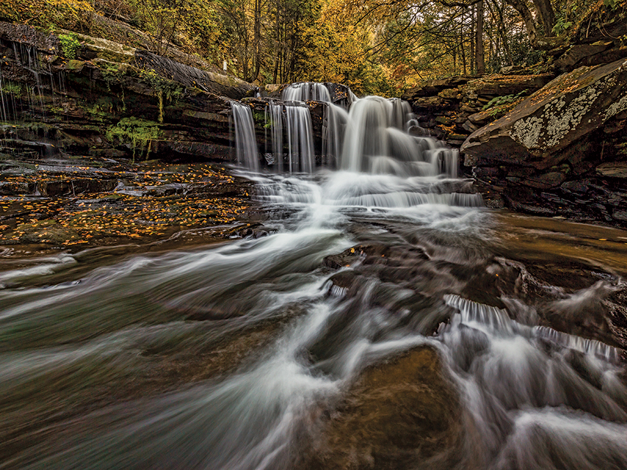 Dunloup Creek Falls, near Glen Jean, West Virginia. 
This consistent falls is viewable from a pullout along County Road 25, and there are other viewpoints if you explore the stream.