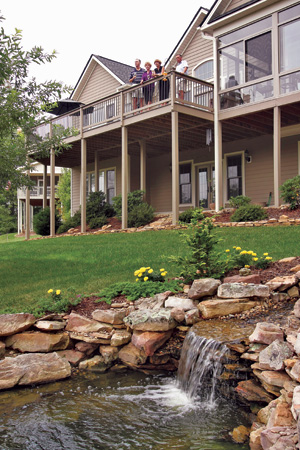 Getting together with neighbors is one of the many pleasures at Cummings Cove. Decks with a view of the golf course, peaks or a soothing koi pond – such as this one in the Wexford neighborhood – are made for easy entertaining.