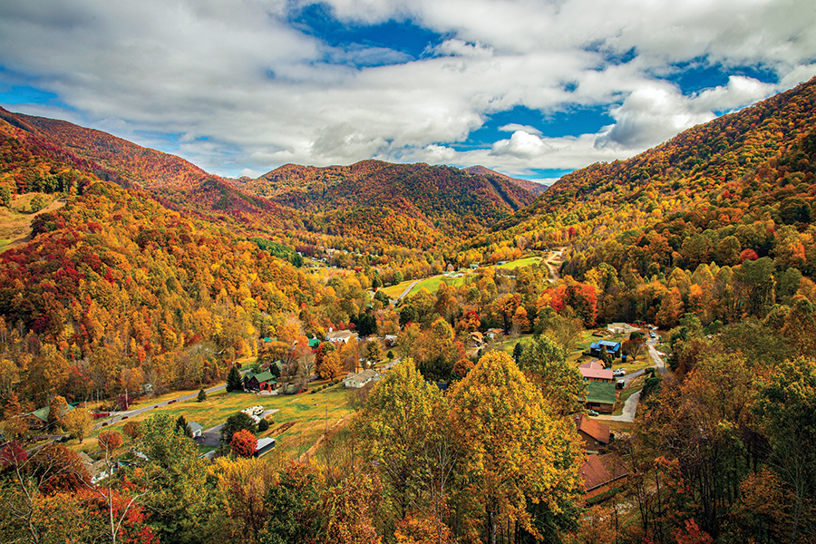 This bird's eye autumn view is of Maggie Valley, North Carolina, as seen from the tower at Soco Crafts on US Highway 19. Billed as "the most photographed view in the Smokies," the tower boasts stunning views of the Great Smoky Mountains and the valley below.