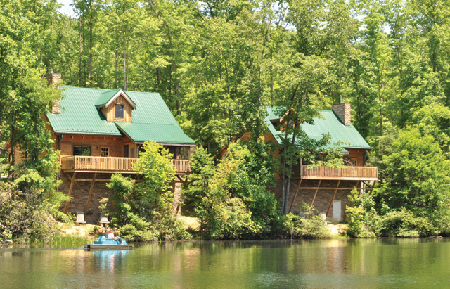 The Breaks Interstate Park cabins overlook Laurel Lake, where visitors can paddle a canoe.