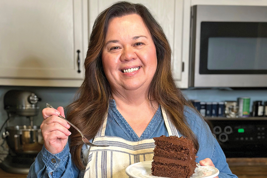 Missy Jones presents her homemade chocolate cake with buttercream frosting.
