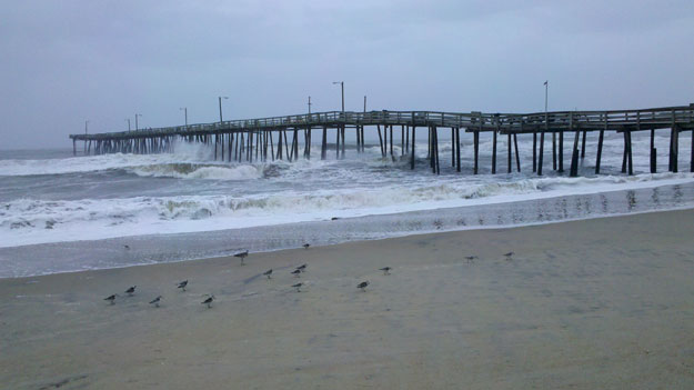 High surf under the pier.