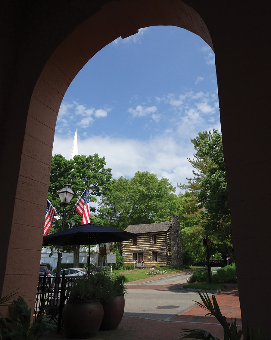 An alley archway frames the Christopher Taylor house on Main Street.