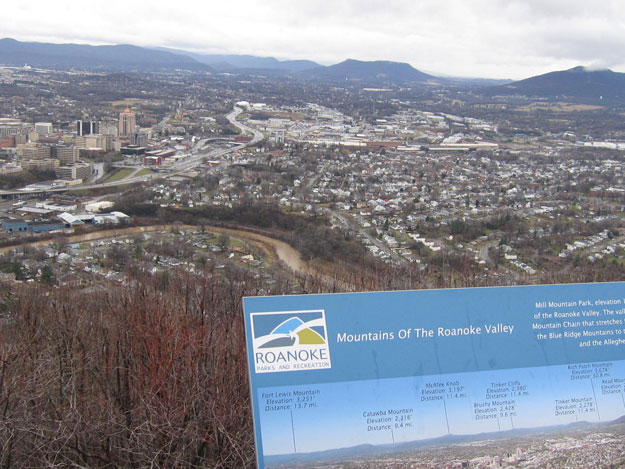 With strong rains only hours behind, the river far below the Mill Mountain overlook ran deep and muddy, but stayed within its banks. (Note the recently installed guide to area mountains at the overlook.)