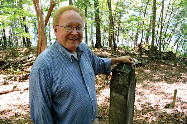 Historian Jerry Taylor smiles as he conducts ravesite tours of Cemetery Island on Lake Chatuge in Georgia.