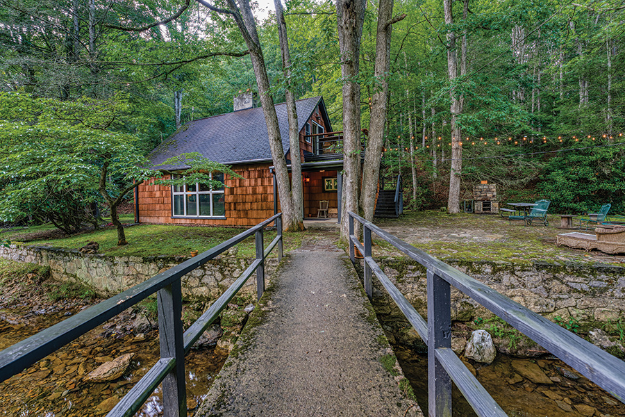 Secluded Hungry Mother Island cottage is surrounded by the rushing waters of Hungry Mother Creek.