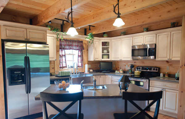 Ron and Pam Musick’s log home features vaulted ceilings in the living room, three bedrooms and a spacious kitchen.