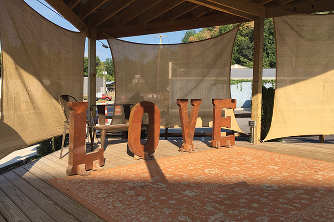 Virginia’s 50-year-old LOVE slogan marks the concert stage behind the Western Front Hotel.