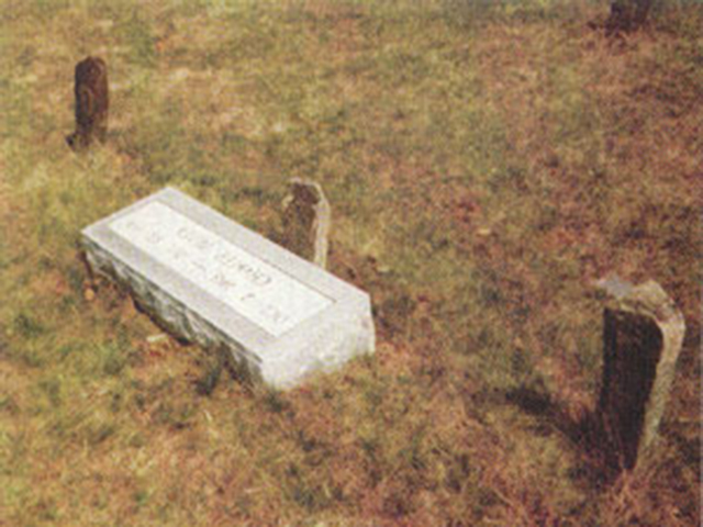 The stone directly behind the modern marker and the stones to the right and left mark Charlie's final resting places.