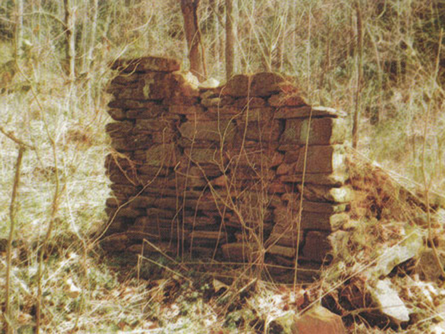 Remmants of a Tragedy. Parts of the chimmey are all that remain of the cabin where young Frankie and Charlie lived the brief time of their marriage.