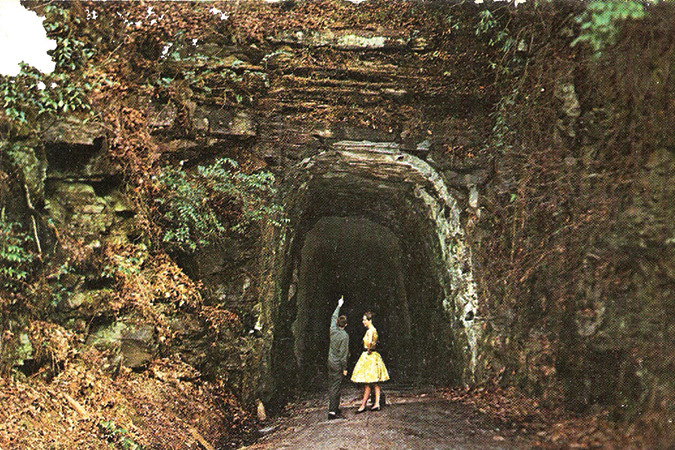 A 1950s couple visiting the half-completed Stumphouse Mountain.
