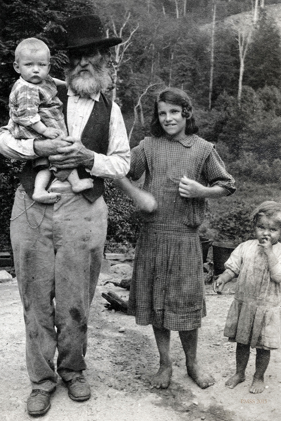 William Creech stands with grandchildren.