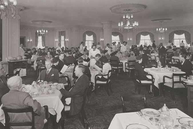 The first-time visitor  was escorted by a tuxedoed waiter with a napkin draped over his arm to a crisp, white, perfectly pressed tablecloth and utensils “too pretty to eat with.”