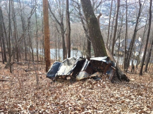 The old black Chevrolet was allegedly found along the wide trail in the '60s and pushed down the hill to where it has rested and rusted ever since.