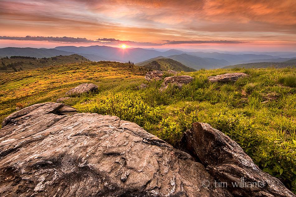 Spring sunset on the Balsam highlands-- Shining Rock Wilderness, NC

Every bit of my focus was placed on the narrow gap between the mountaintop and that long, dark cloud, wondering what might happen if the sun emerged briefly before sinking out of sight. Just moments prior, the entire landscape lie in grey shadow.