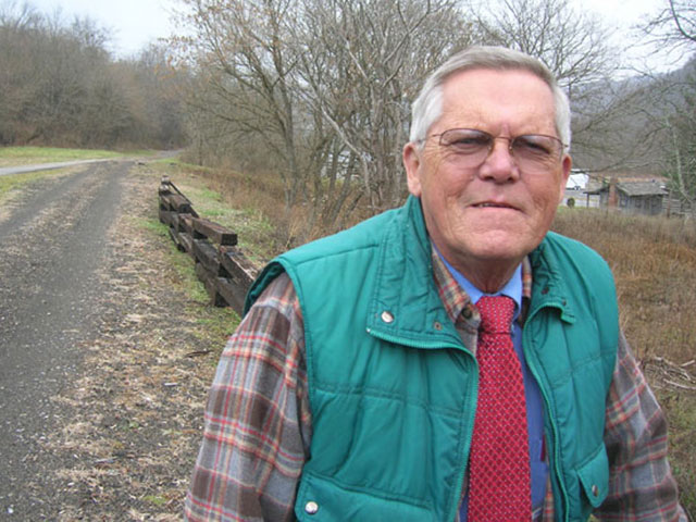 Saltville Tourism Director Charlie Totten stands next to the town's rails-to-trails project.