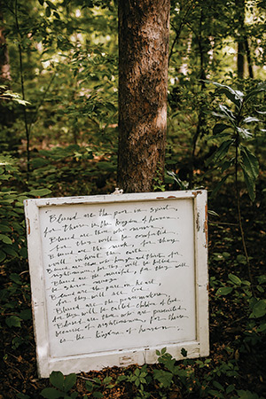 Joanna Simone’s “word paintings” range from simple phrases such as “Home is where my boys are,” to longer pieces, such as above. All are framed in upcycled wood.
