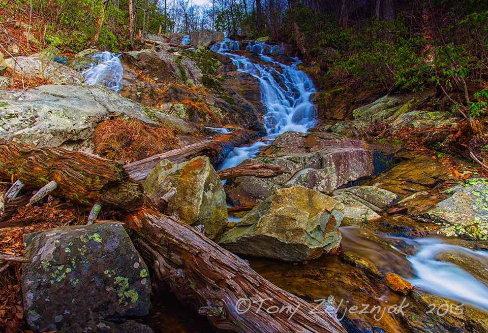 Water. It is a fleeting substance, it flows through our fingers, it evaporates, it boils away. Yet what we think of solid, rocks, trees, the earth, they all fall victim to the power of water. (Falling Water Cascades near Peaks of Otter on the Parkway)