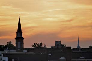 The sun sets over the steeples in Hagerstown.