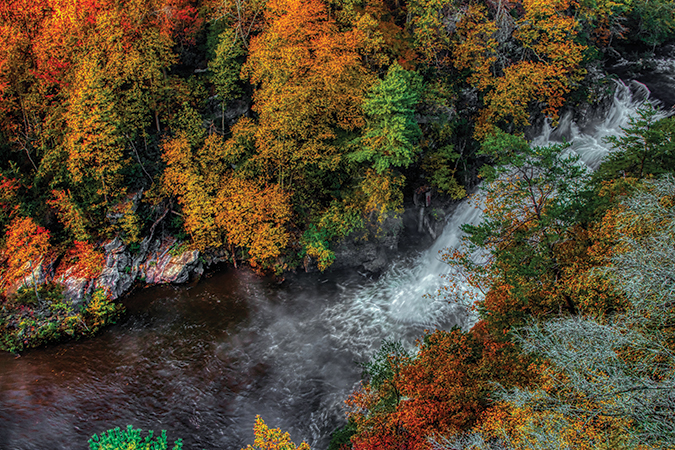 Tallulah Gorge in North Georgia’s Tallulah Gorge State Park. From the photographer: “The first of the five falls in the gorge is the L’Eau D’or Falls (“Golden Water”). The sights and sounds of this powerful waterfall and the golden light that surrounds it in the early morning makes this a special location to spend a cool fall morning. The L’Eau D’or Falls can be viewed from the Tallulah Gorge trail from overlooks 2 and 3.”