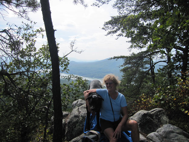 The Day Hiker and her dog, with Carvins Cove in the background.