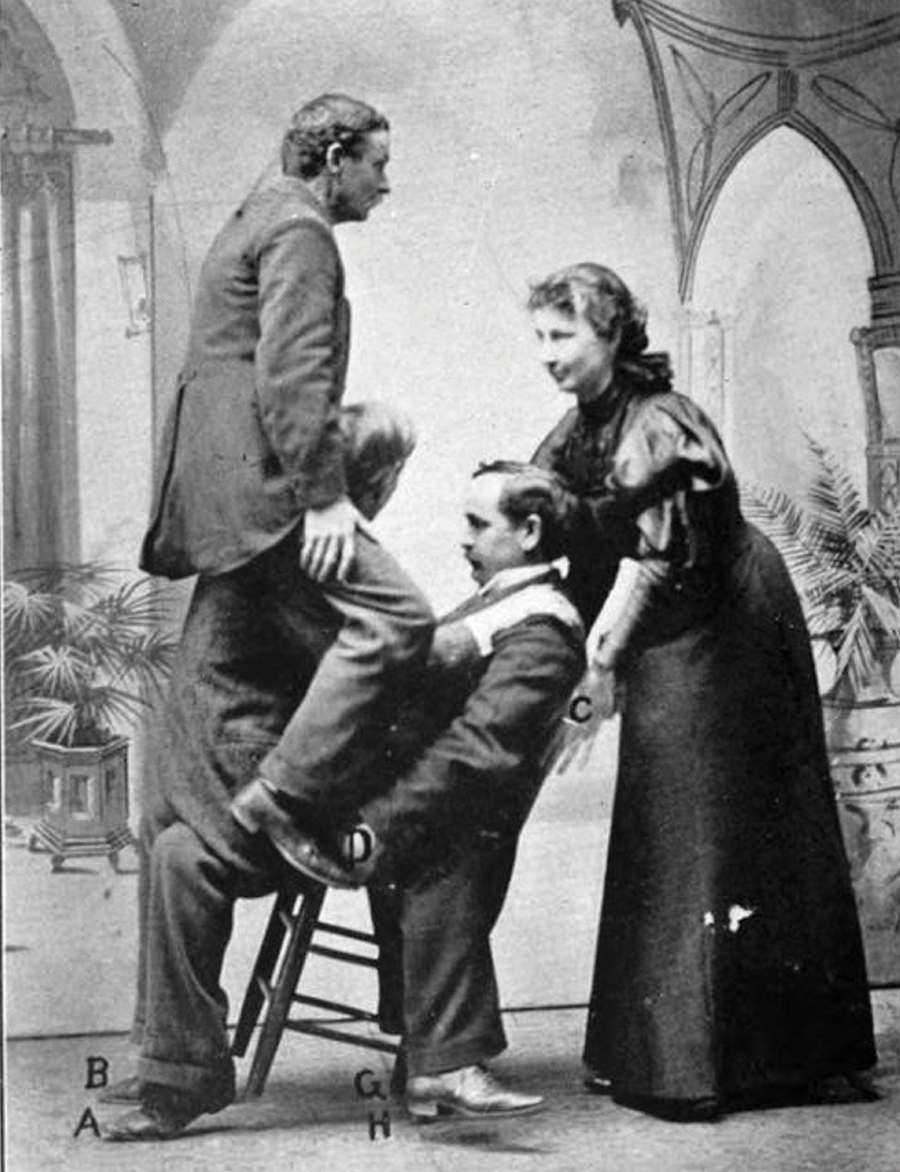 Lulu Hurst demonstrates her technique of overpowering and lifting three men on a chair.