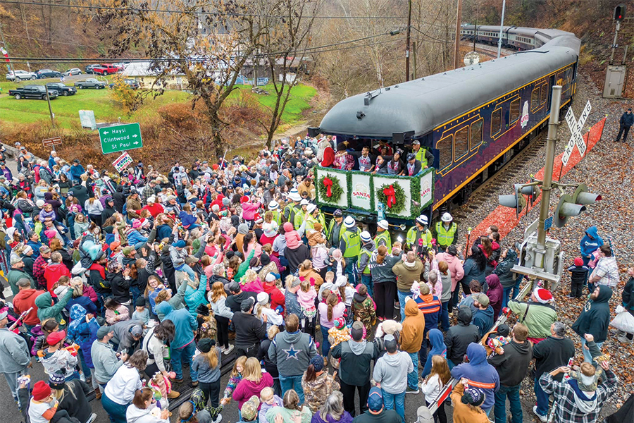 Heritage locomotives pull 15 tons of gifts across a 110-mile journey in the mountains on the Kingsport, Tennessee, CSX Santa Train.