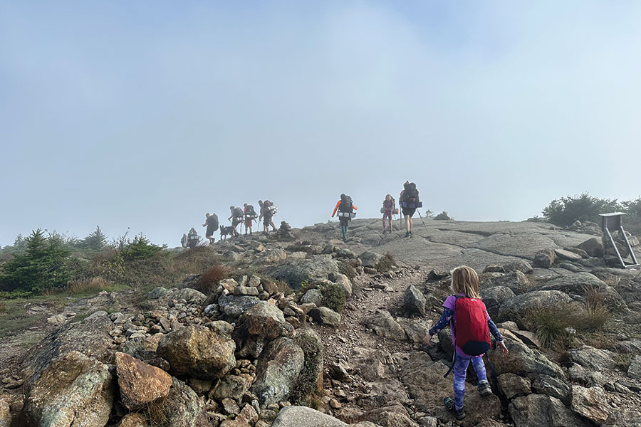 The Bettises chose to hike in a single-file line, with older family members alternating in taking up the rear. Opye, the youngest, walked every mile of the trail unassisted and was thus able to obtain a special permit giving her permission to summit Katahdin Mountain in Baxter State Park, Maine.