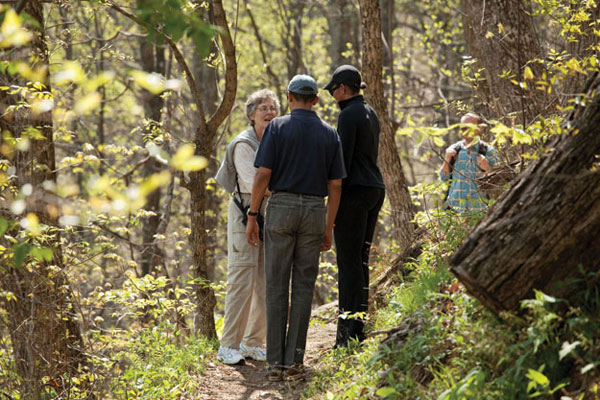 President Barack Obama and First Lady Michelle Obama meet Karen Russell on a hiking trail off the Blue Ridge Parkway near Asheville, N.C.