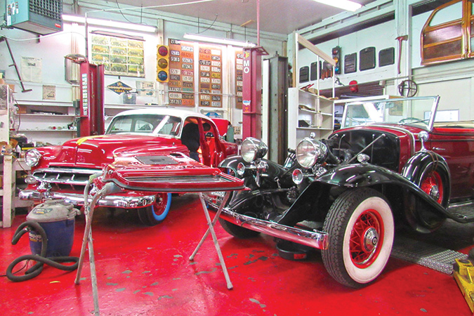 A 1954 Chevrolet 4-door 210 sedan; to the left of a 1932 Cadillac recently acquired by a client in Northern Virginia.