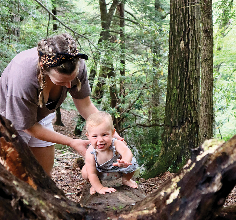 Laura and Rory share a moment on the forest floor.