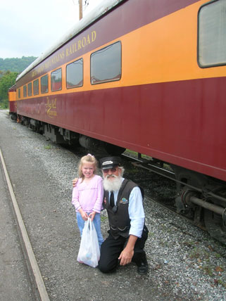The writer's daughter meets a Great Smoky Mountains Railroad train conductor.