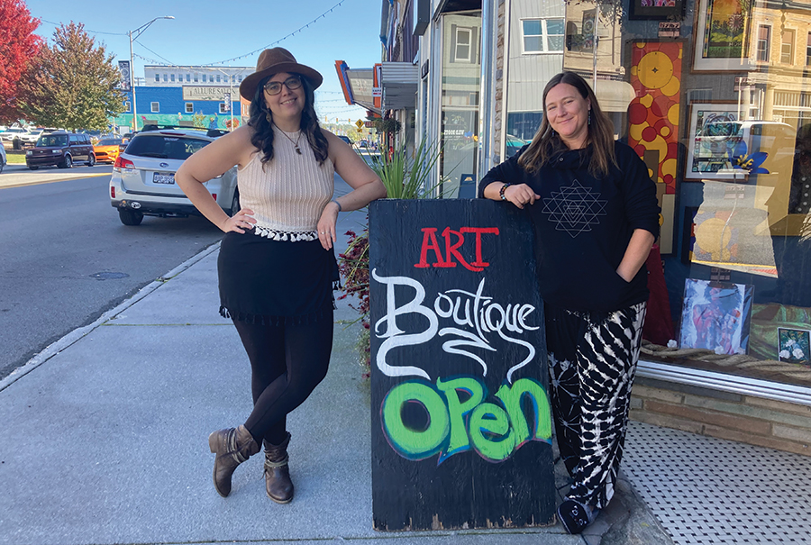 Artist and Gallery manager Shannon Shine and RiffRaff Executive Director Lori McKinney stand on Mercer Street.
