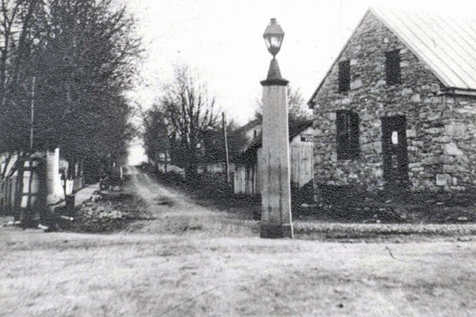 This undated photo shows a much earlier construction of the often-damaged post.