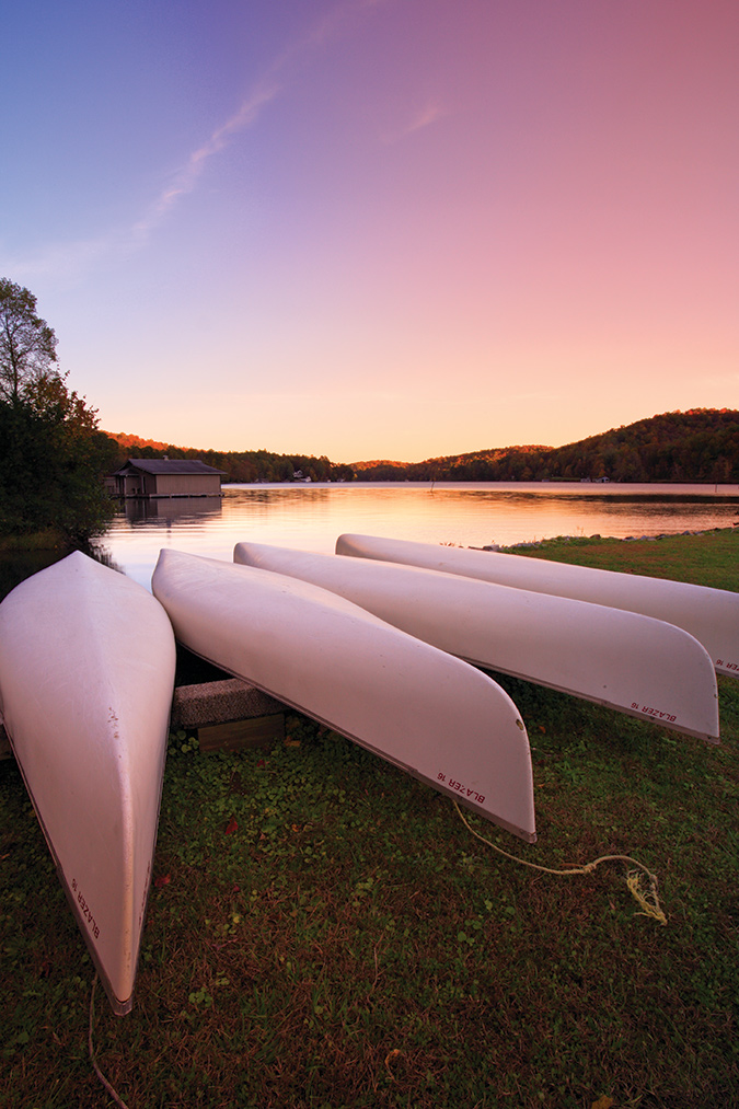 The photo is taken at Lake Burton in Moccasin Creek State Park, Clayton, Georgia.  The canoes, sunset and  reflection called out for the tripod.
