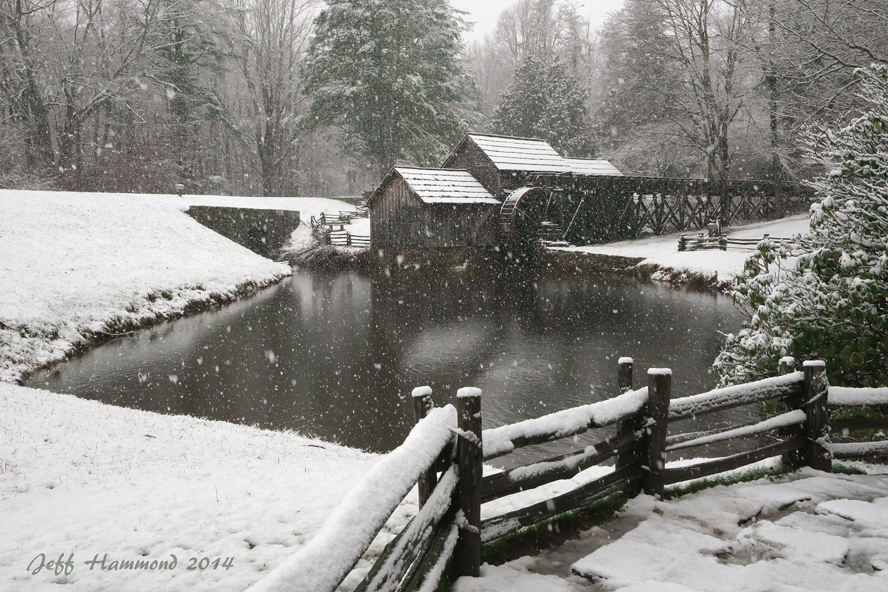 It's a rare thing anyway to see a shot of the mill while the snow is falling, but this was a truly special day that won't come around that often. The weather had been warm leading up to the snow, so the pond was not partially iced over like it is most of the time in winter giving it a "messy" look. The snow was a heavy wet one so it was clinging nicely to everything and the flakes large enough to show up great in the photo. I was here alone this day due to the really slick nature of the highways and the treacherous driving, and this photo from a different angle of my more well known shot has never been released for viewing before.