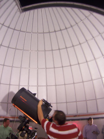 Nathan Pruitt adjusts the Primland observatory telescope.