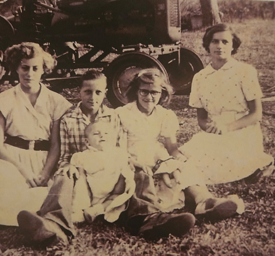 A happy, young Eula with glasses.