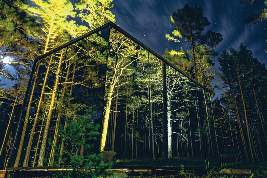 This example photo shows the construction technique of the Bolt Farm mirror-created “invisible” cabins, from which during daylight no one outside can see inside; curtains keep nighttime private.