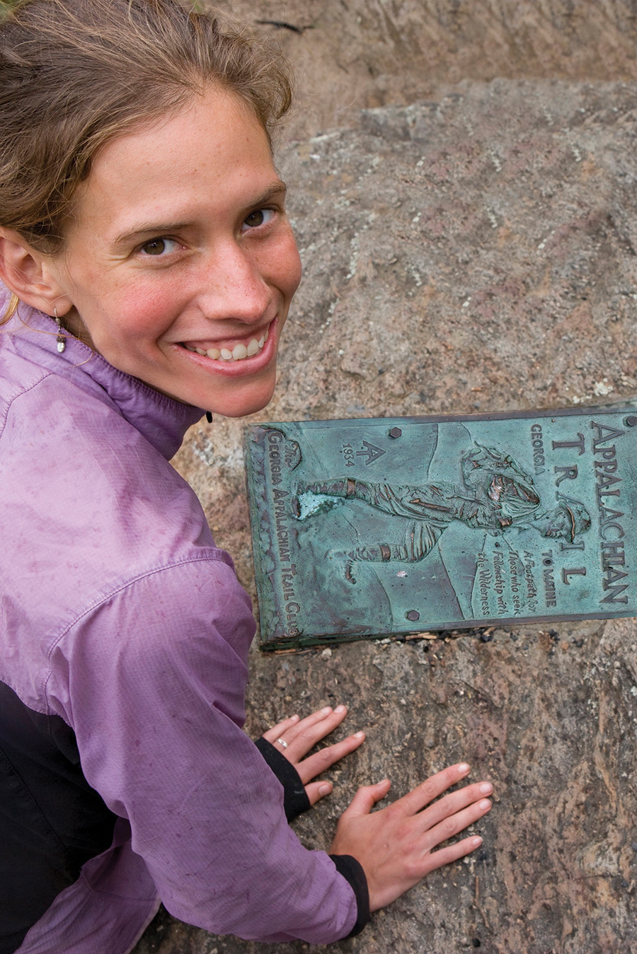 Davis smiles from the southern end of the Appalachian Trail where her 2011 46-day thru-hike ended