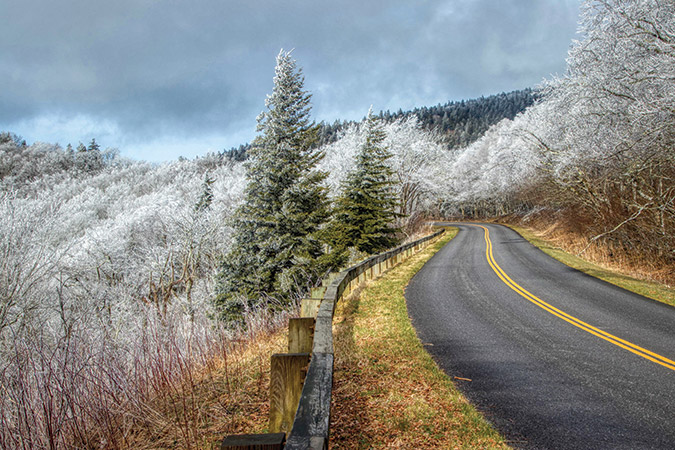 Hoarfrost covers the trees with both whimsy and drama near the Craggy Mountains on the Blue Ridge Parkway at milepost 350 in North Carolina.