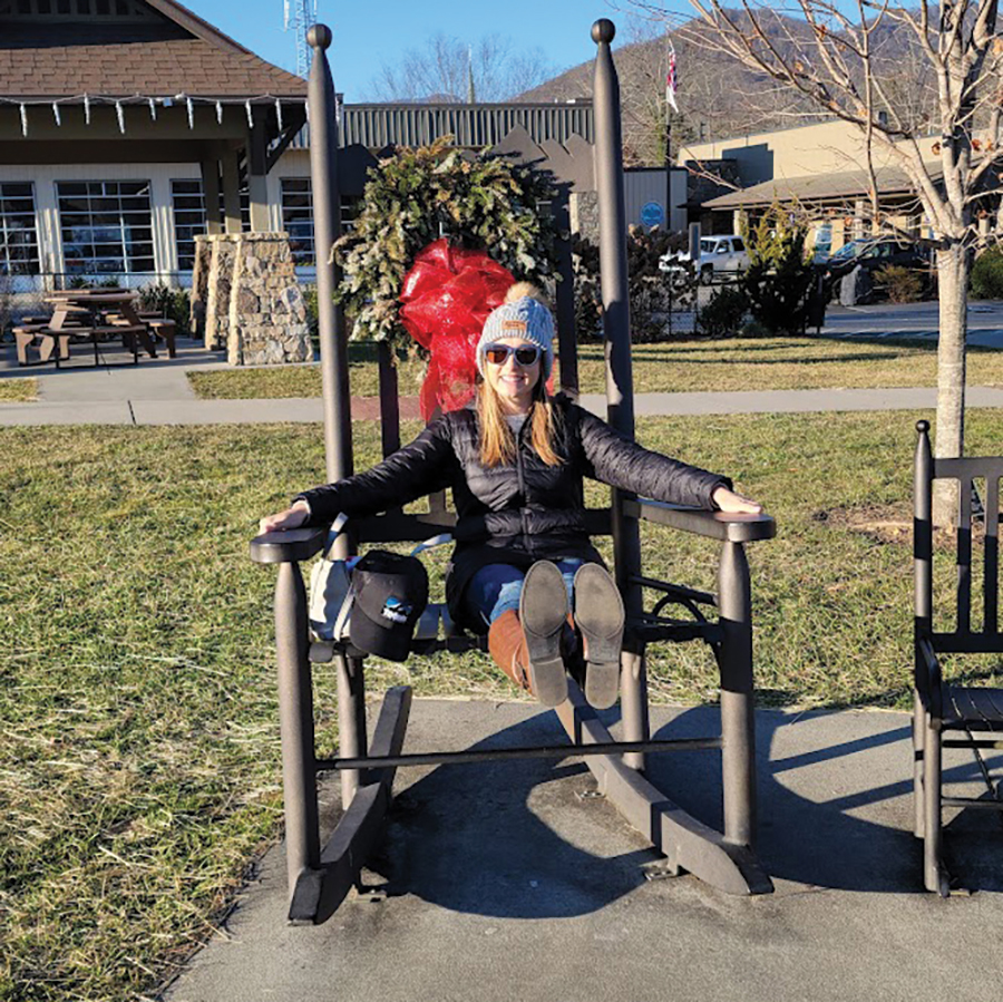 Olivia Ward sits in an oversized rocker in 
a town known for its rocking chairs.