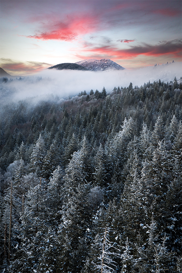 The view atop Devil’s Courthouse in North Carolina during a winter evening sunset over the Blue Ridge Parkway (Milepost 422). From the photographer: “It was a treacherous hike up the icy pathway for a few moments of stunning scenery.”