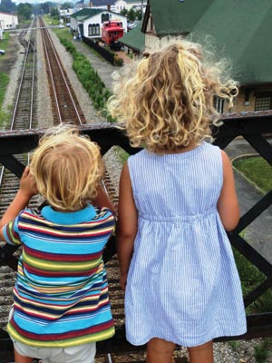 The Yokim kids wait to watch a train in Abingdon.