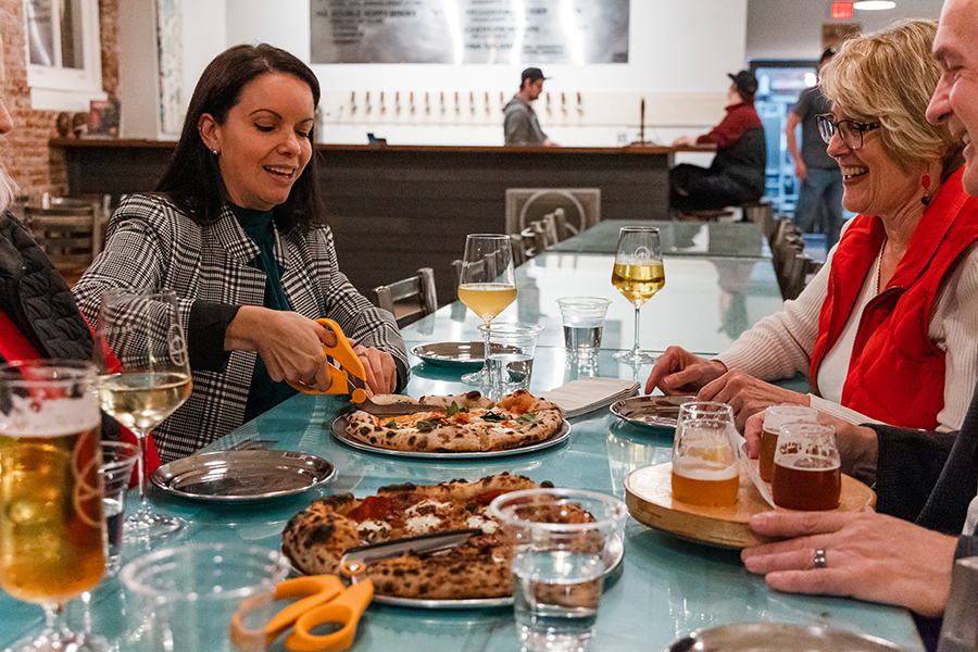 Enjoy craft brews and wood-fired pizzas made with local ingredients at Heliotrope Brewery.