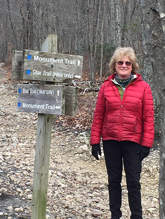 The Greatest Day Hiker Of Them All pauses at the intersection of the Star and Monument trails before heading on around the mountain toward breakfast.