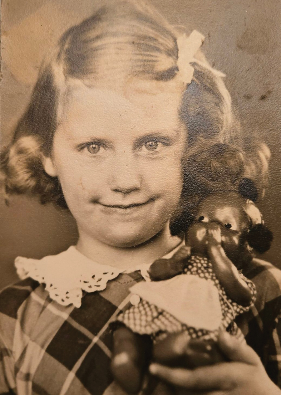 A happy, young Eula with her coveted black baby doll.
